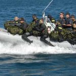 The Amphibious Scout Teams make their way up the coast of Vancouver Island to practice littorial exercises in the waters off Metchosin.