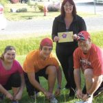 The King family lace up their runners in preparation for the Navy Run. This family will run together in the 10K portion as a gift to mom for Mother’s Day. Seen here are Kalliana King, Koltin King, PO1 Mike King, and Cathy King holding her Mother’s Day card.