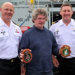 Port Clements Mayor Wally Cheer accepts ships’ plaques from Commanding Officers of HMC Ship Brandon and Edmonton, LCdr Lawrence Moraal and LCdr Brad Henderson.