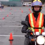 Shelley Fox sits on one of the Learn to Ride 250cc motorbikes at the Jetty parking lot where she was practicing the skills needed to pass the ICBC Motorcycle Skills test.