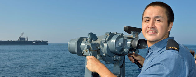 Ordinary Seaman Frank Grant observes USS John C Stennis from the starboard bridge wing of HMCS Regina during Operation Artemis. Ordinary Seaman Frank Grant observes USS John C Stennis