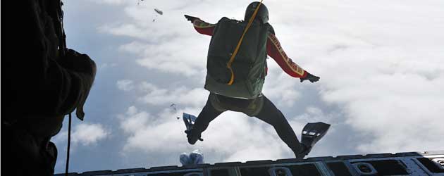 Cpl Philippe Morin feels the wind pushing up on his flippers as he jumps out of a Hercules aircraft near CFB Esquimalt during Exercise Trident Fury 13. Diver jumps from Hercules aircraft