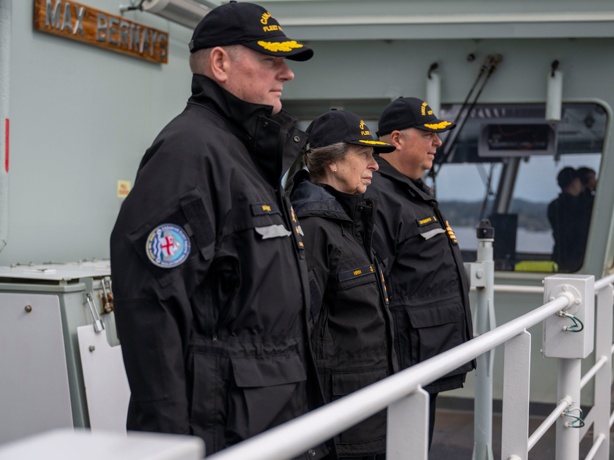 Her Royal Highness, Princess Anne, The Princess Royal, Honourary Commodore-in-Chief of the Canadian Fleet Pacific (middle), Commodore David Mazur, Commodore of Canadian Fleet Pacific (left), and Commander Collin Forsberg, Captain of HMCS Max Bernays, gather on the ship’s bridge wing to prepare for arrival to CFB Esquimalt on May 4.

