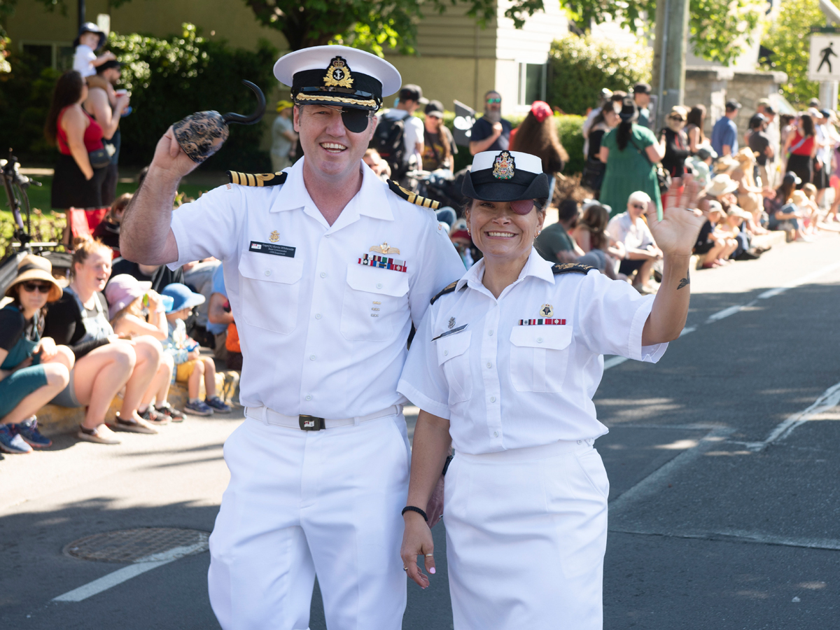 Captain (Navy) Kevin Whiteside, Canadian Forces Base (CFB) Esquimalt Base Commander, and Chief Petty Officer 1st Class Sue Frisby, CFB Esquimalt Base Chief, march in the parade at Buccaneer Days on May 11. Photos: Master Corporal Nathan Spence, Maritime Forces Pacific Imaging Services.
