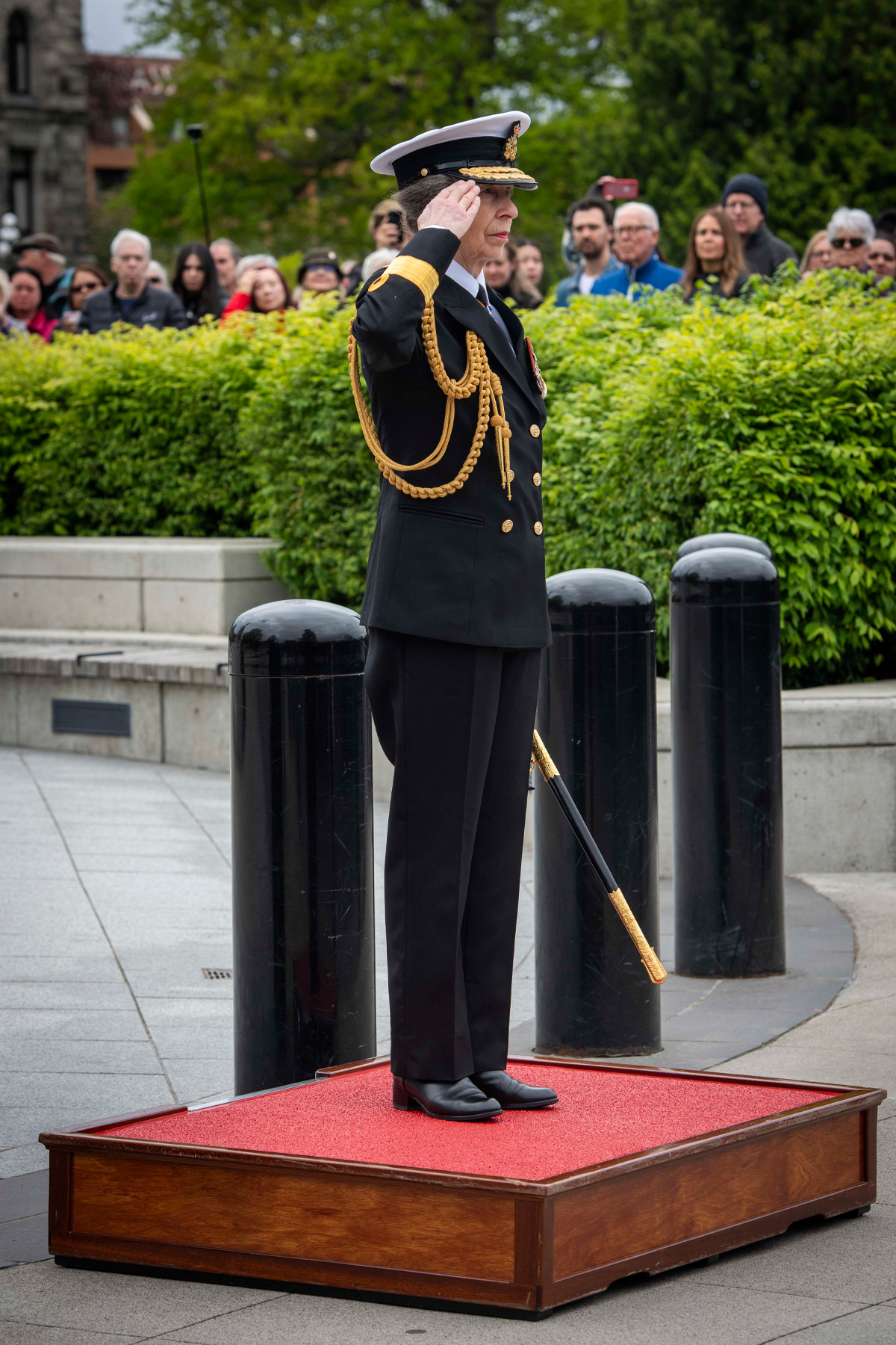 Her Royal Highness Princess Anne salutes the Battle of the Atlantic parade at the Victoria Cenotaph. Photo: Cpl Tristan Walach, MARPAC Imaging Services.