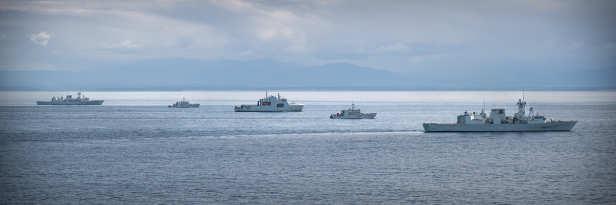 Aerial photo of HMCS Regina, HMCS Yellowknife, HMCS Max Bernays, HMCS Edmonton, and HMCS Vancouver from 443 Squadron Helicopter during Task Group Exercise 24-01, on May 1. Photo: Sailor Third Class Mckayla Ryce, MARPAC Imaging Services.