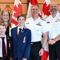 (L-R) Jackson, Meghan, Nathaniel and Commodore Matthew Coates with presiding officer Rear-Admiral Chris Robinson. Photo: Michael McWhinnie.