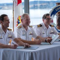 Captain (Navy) Mark O’Donohue, Commodore David Mazur and Commander Sam Patchell sign off on documents to confirm the Change of Appointment for Commander Patchell as Deputy Commander of Canadian Fleet Pacific, June 25. Photos: Master Sailor Valerie LeClair.