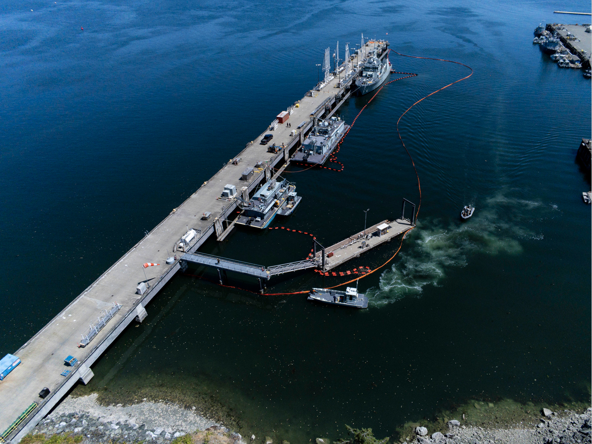 Members of the Incident Response Team conduct a spill response exercise (SPILLEX) at Canadian Forces Base Esquimalt, British Columbia on July 10. 
Photo: Sergeant Malcolm Byers, MARPAC Imaging Services