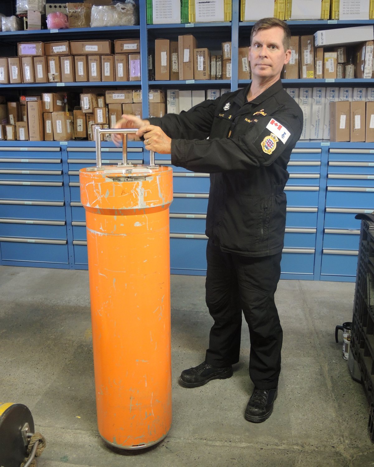 Chief Petty Officer 2nd Class (CPO2) Nelson Harvey, National Submarine Search and Rescue Coordinator displays CANSUBFOR PODs. Photo supplied.