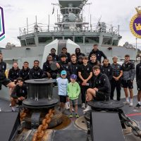 Members of the Pacific Football Club pose for a group photo on HMCS Regina at CFB Esquimalt. Photos: Sailor 3rd Class Jacob Saunders, MARPAC Imaging Services.