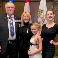 The Byrnell family while being awarded the Queen Elizabeth II Diamond Jubilee Award.