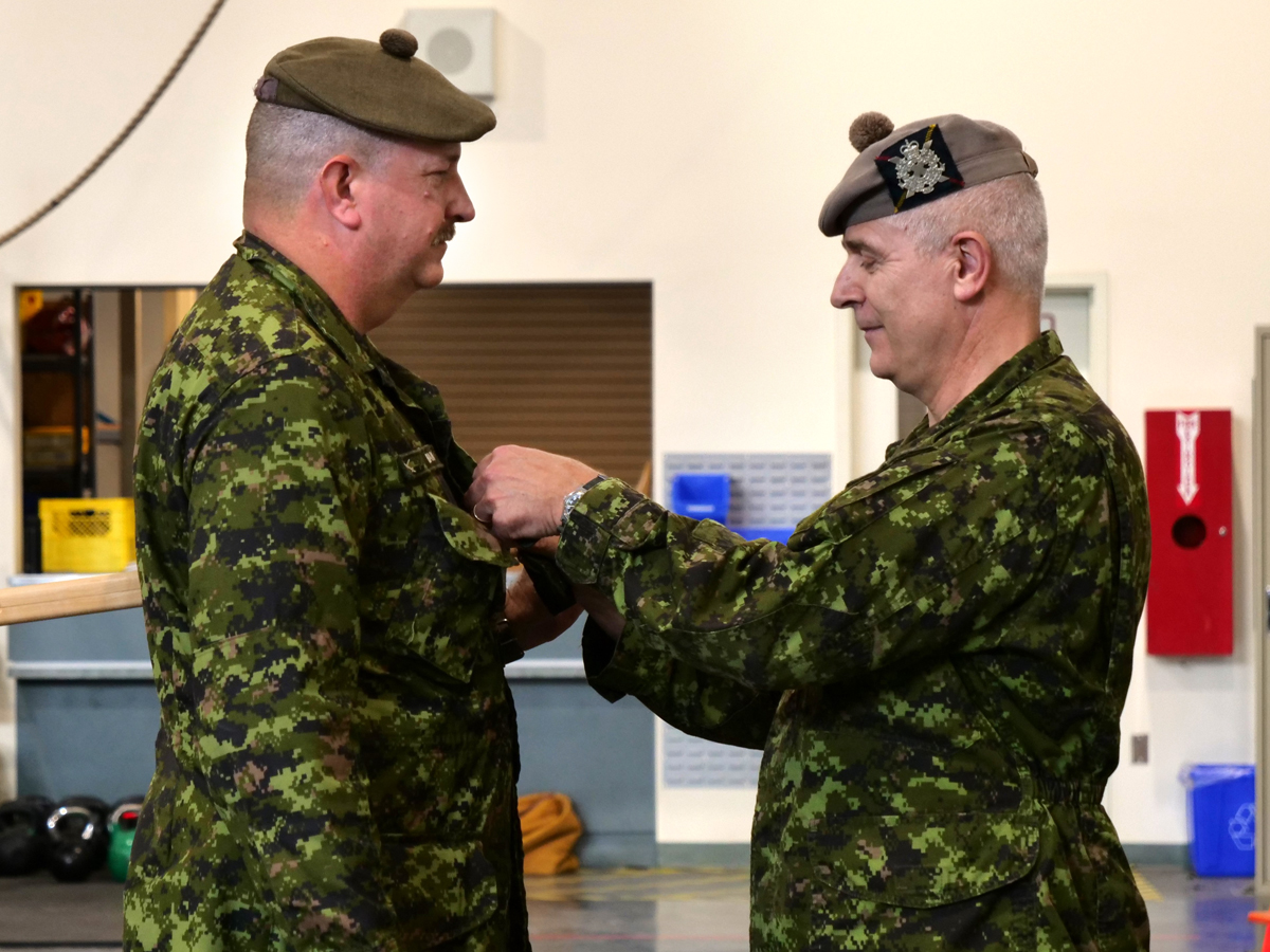 Master Warrant Officer Mike Bean (left) is promoted by Lieutenant-Colonel Slade Lerch, Commanding Officer of The Canadian Scottish Regiment (Princess Mary’s). The Canadian Scottish Regiment is Vancouver Island’s own infantry regiment in the Army Reserves of the Canadian Armed Forces. 
