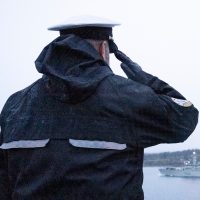 Rear-Admiral C. Robinson, Commander Maritime Forces Pacific salutes from Duntze Head. Photo by: Master Corporal Andre Maillet, MARPAC Imaging Services