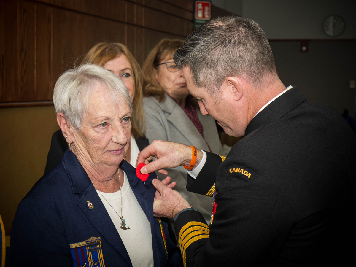 Base Commander Captain (Navy) Kevin Whiteside, pins a poppy onto Syvlia Vink, 1st Vice President and Poppy Chair of Royal Canadian Legion Branch 172 at the first poppy pinning ceremony held at the Chiefs & Petty Officers' Mess, Canadian Forces Base (CFB) Esquimalt on Oct. 25.
Photo: Sailor 1st Class Brendan McLoughlin, MARPAC Imaging services