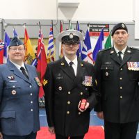 Master Sailor (MS) Guay receiving his Canadian Decoration 3 Clasp. From Left to right: Lieutenant-Colonel L.J. Rediger, MS S. Guay, and School Chief Warrant Officer M.R. Lanctot. Photo supplied