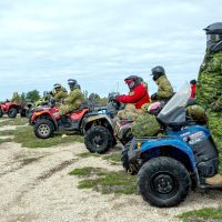 Members of the 4th Canadian Ranger Patrol Group and the Australian Defence Force’s North West Mobile Force prepare to depart for a patrol exercise during Exercise Northern Lights 24.