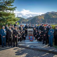 Representatives from HMCS Ottawa, the Town Council of Onagawa, and the Kanda family, surround the memorial to Lieutenant Robert Hampton Gray VC, DSC, following the ceremony on Nov. 26 in Onagawa, Japan. Photo: Sailor 3rd Class Jacob Saunders.