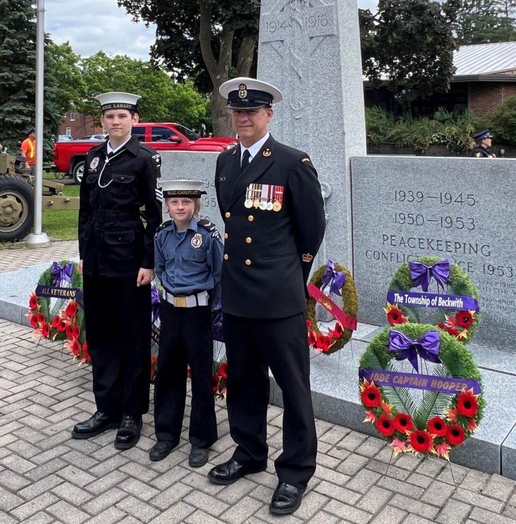 (Left to right) Petty Officers 1st class Patrick, Matthias, and Brendan Huber pose together on Remembrance Day. Photo credit: Kathryn Huber