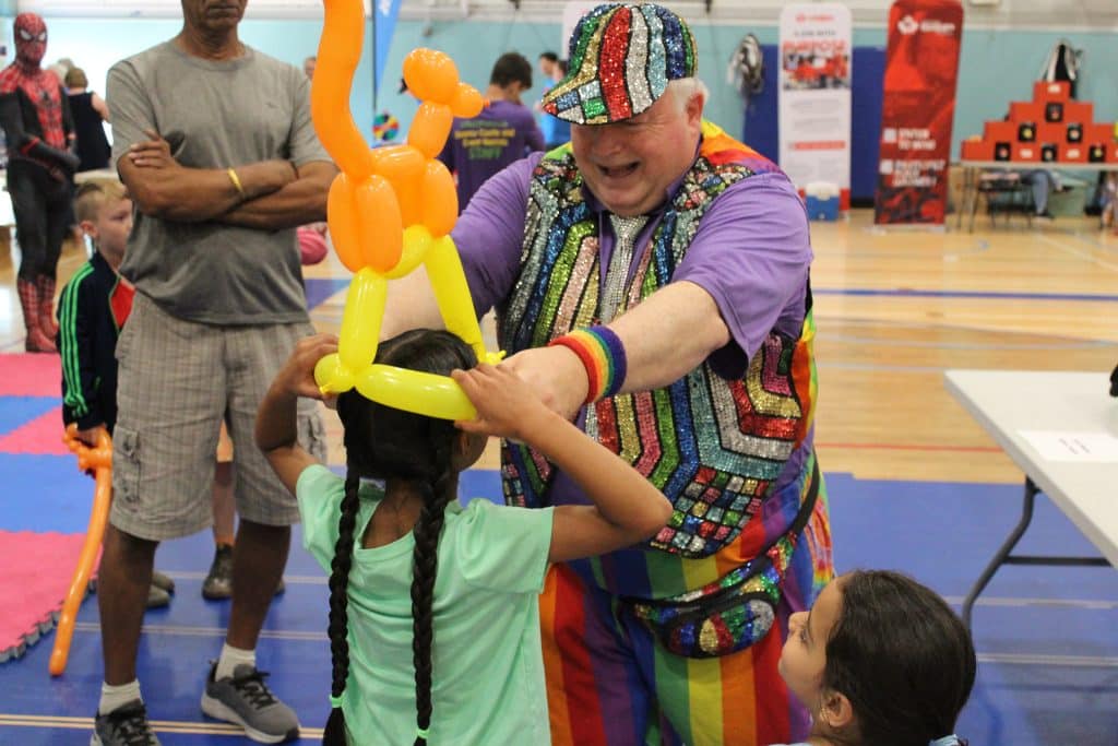 A child receives a hand-twisted balloon crown during Formation Fun Day on Sept 7. Photo: Lindsay Groves