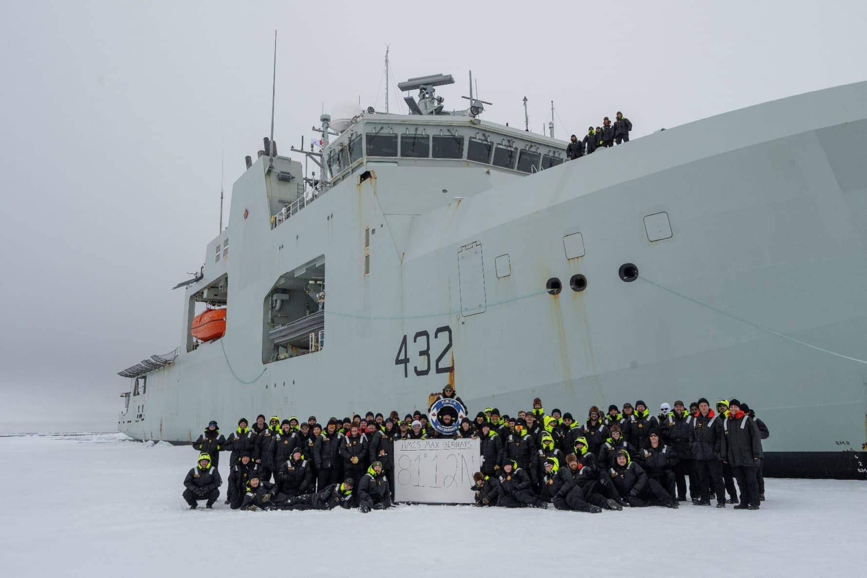 The Ship’s Company of His Majesty’s Canadian Ship (HMCS) Max Bernays celebrate reaching the highest northern point of any Royal Canadian Navy (RCN) ship on Aug 29, 2025. Photo: Sailor 1st Class Jordan Schilstra, Canadian Armed Forces