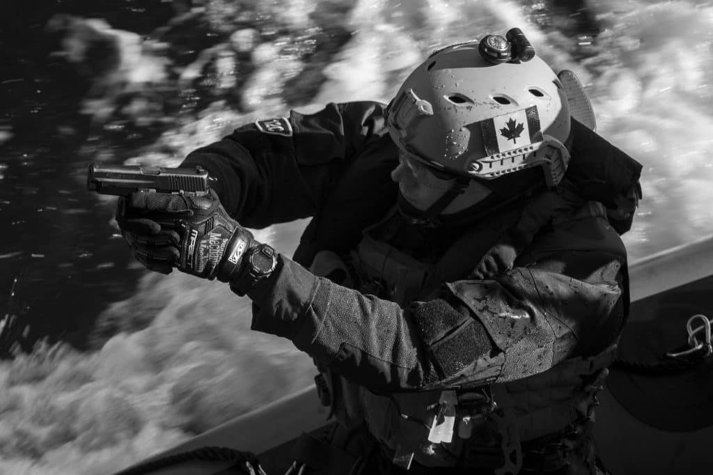 A member of the Enhanced Naval Boarding Party from Her Majesty’s Canadian Ship (HMCS) WINNIPEG prepares to board Portuguese flagship, NPR DON FRANCISCO DE ALMEIDA during Operation (Op) REASSURANCE. Photo: Cpl Stuart MacNeil
