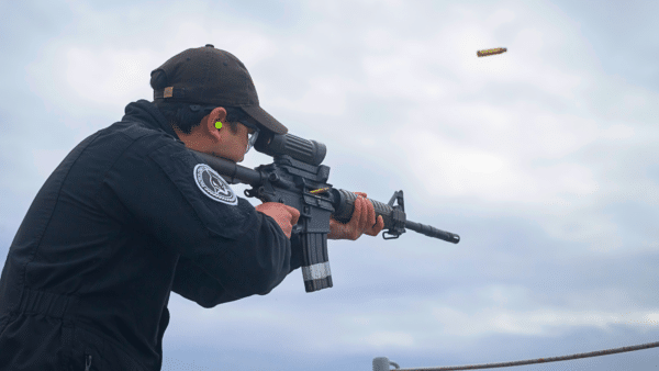 S1 Justin Vonn Arenas shoots the C8 rifle during the small arms shoot conducted aboard PCT vessel COUGAR on April 22. Photo: S1 Jordan Schilstra