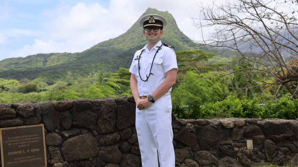 Lt(Navy) Bob Seed poses outside Le Jardin Academy in Hawai‘i 10 years after his graduation. Photo courtesy of Le Jardin Academy.