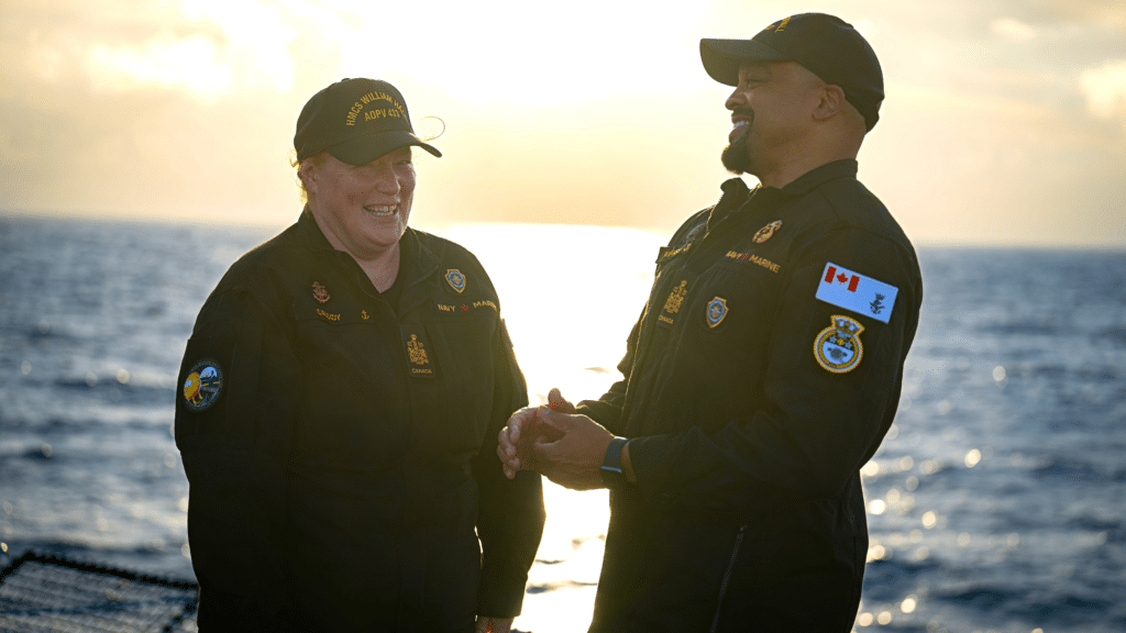 Two sailors aboard the flight deck of HMCS William Hall on June 15. Photo: Cpl Mitchell Paquette, CAF Imagery